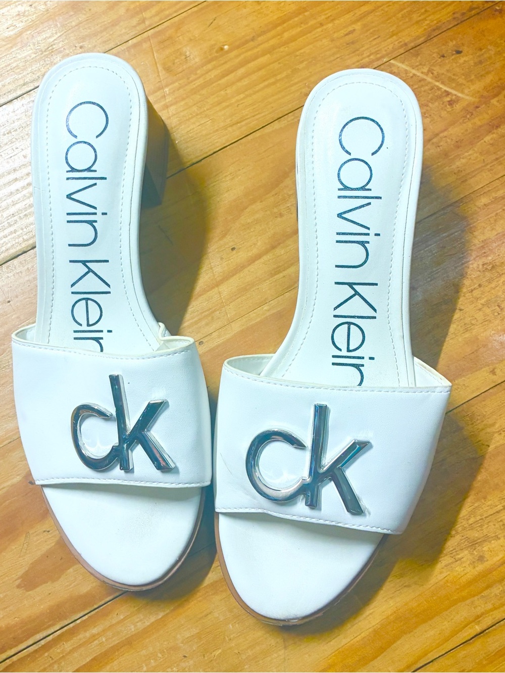Calvin Klein White Slide Mules with Silver CK Emblem